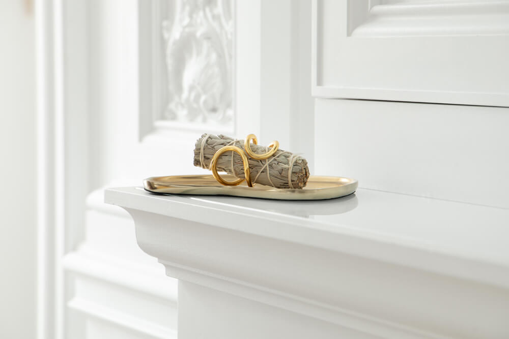 White Sage bundle on on gold tray in luxury home